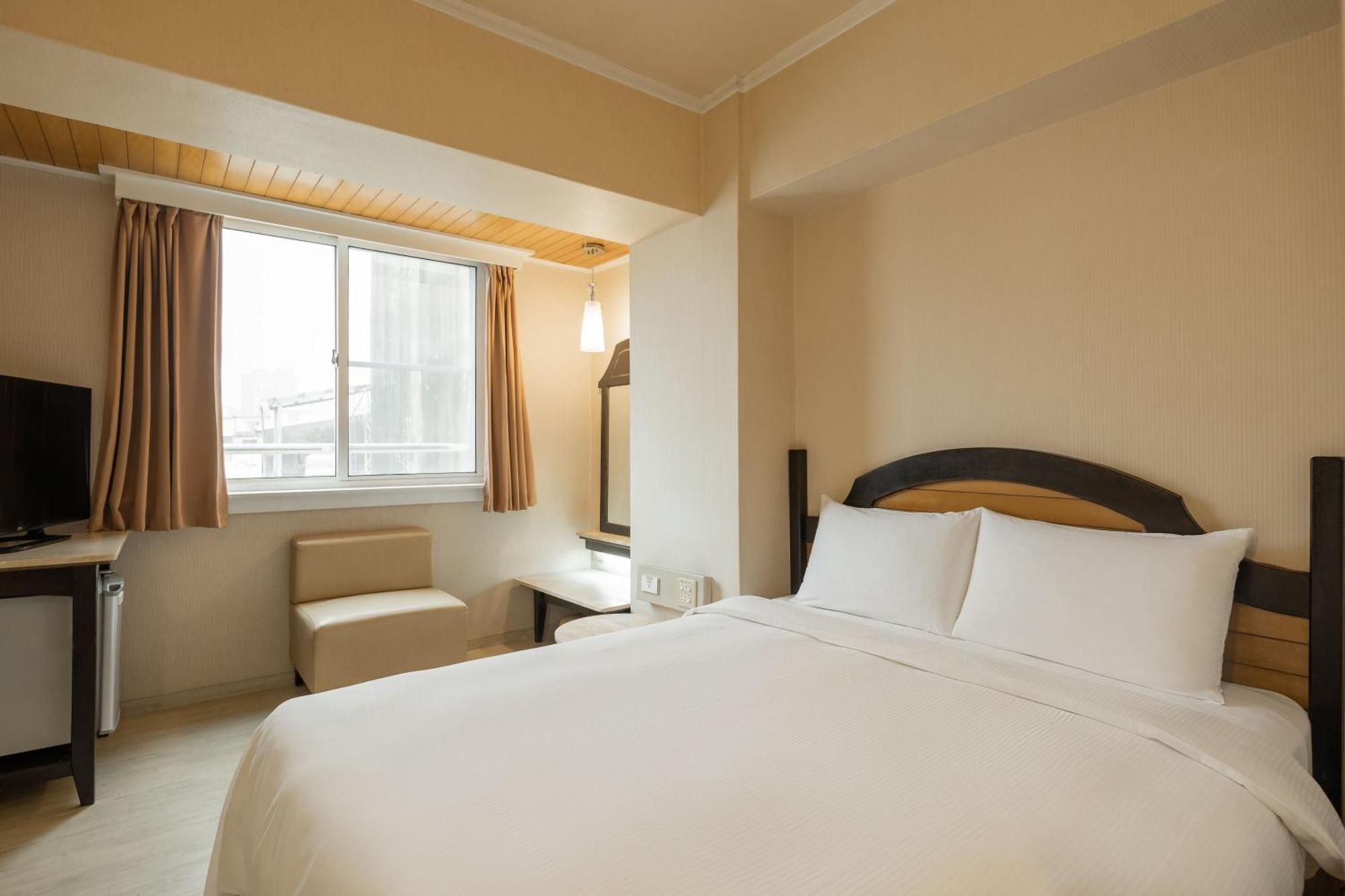 Kindness Hotel Weiwuying Kaohsiung Rom bilde